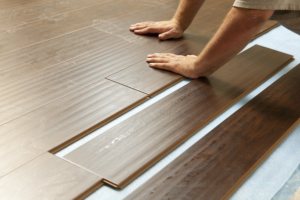 hands and laminate flooring
